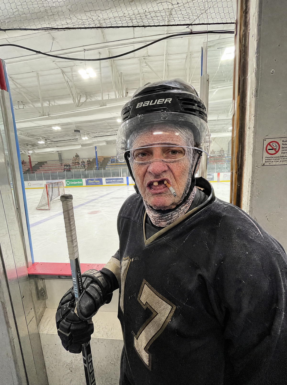 Frosty Face mask worn under a hockey helmet with visor