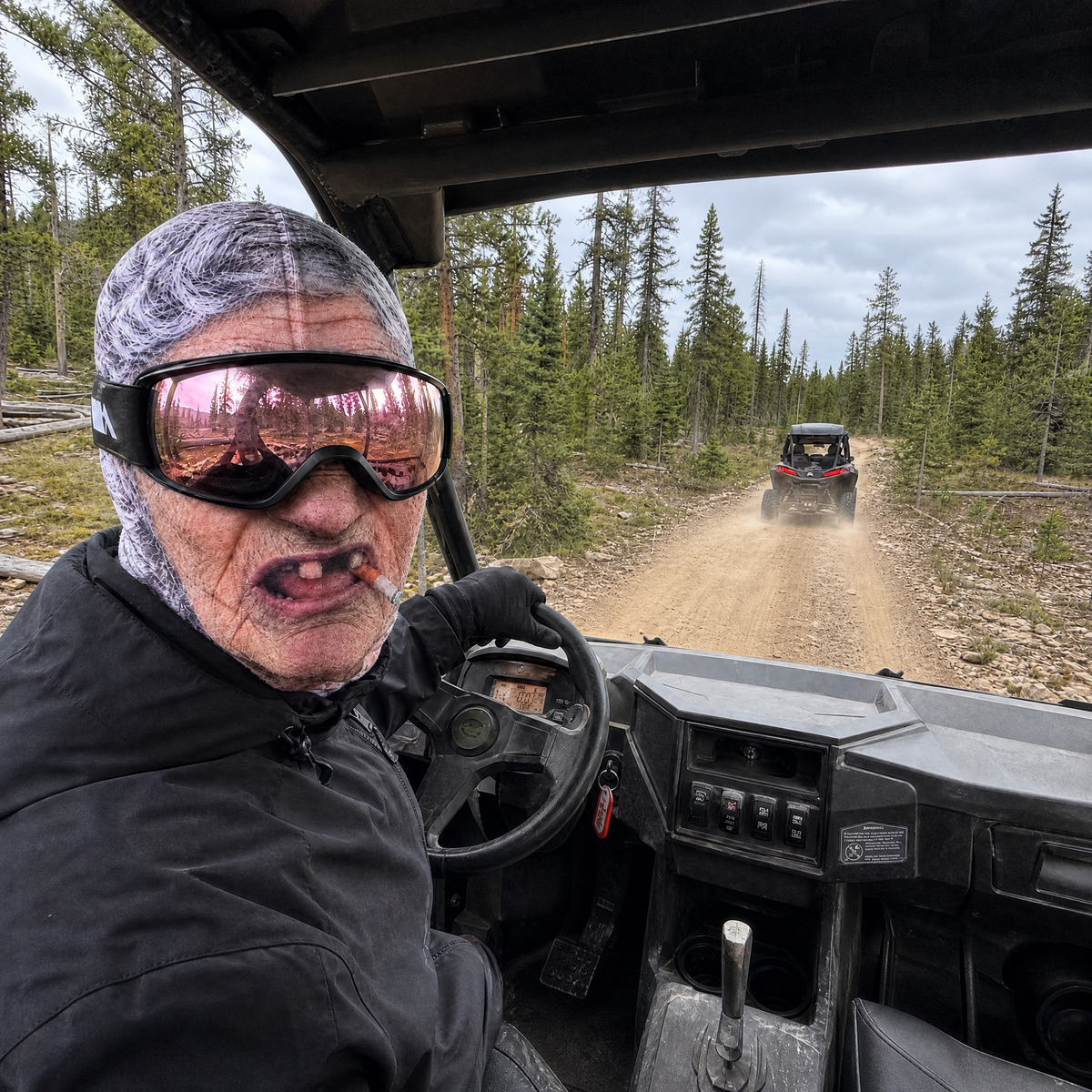 Rider driving UTV on trail in Frosty Face mask