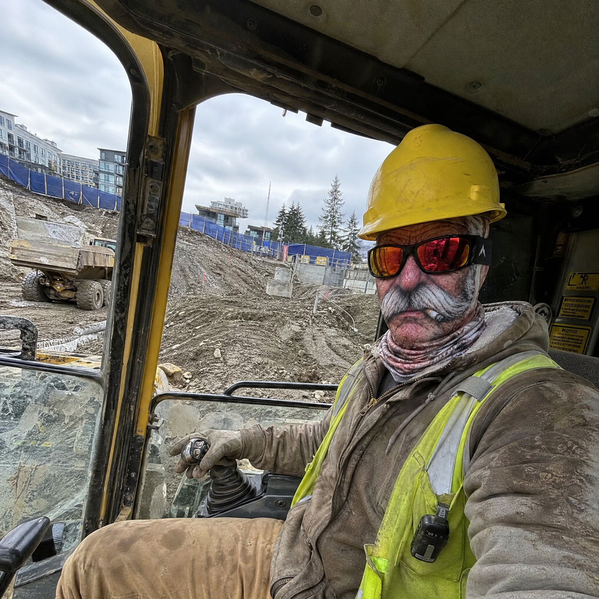 Customer in an excavator wearing the work mask